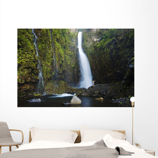 Hawaii, Maui, Nahiku, Woman Standing At Base Of Hanawi Falls Wall Mural
