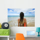 Hawaii, Kauai, Woman Holding Surfboard On Beach, View From Behind Wall Mural