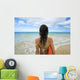 Hawaii, Kauai, Woman Holding Surfboard On Beach, View From Behind Wall Mural