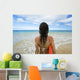 Hawaii, Kauai, Woman Holding Surfboard On Beach, View From Behind Wall Mural
