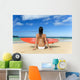 Hawaii, Kauai, Woman Sitting On Beach With Surfboard, View From Behind Wall Mural