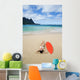 Woman Laying On Beach With Surfboard Wall Mural