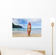 Woman Standing On Beach With Surfboard Wall Mural