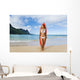Woman Standing On Beach With Surfboard Wall Mural