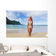 Woman Standing On Beach With Surfboard Wall Mural