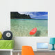 Red Surfboard Floating In Shallow Ocean Wall Mural