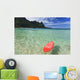 Red Surfboard Floating In Shallow Ocean Wall Mural