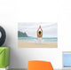 Woman Meditating On Sandy Shore Wall Mural