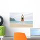 Woman Meditating On Sandy Shore Wall Mural