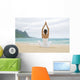 Woman Meditating On Sandy Shore Wall Mural