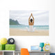 Woman Meditating On Sandy Shore Wall Mural