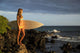 Hawaii, Maui, Makena, Surfer Girl Standing On Rocks At Sunset Wall Mural