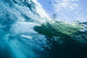 Indonesia, Bali, View From Underwater Of A Surfer Riding A Wave Wall Mural