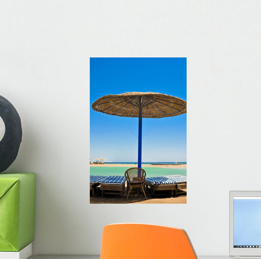 Straw umbrellas on the beach of Egypt Wall Mural