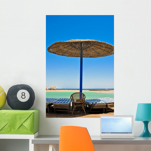 Straw umbrellas on the beach of Egypt Wall Mural