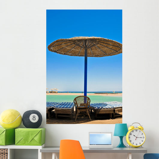 Straw umbrellas on the beach of Egypt Wall Mural