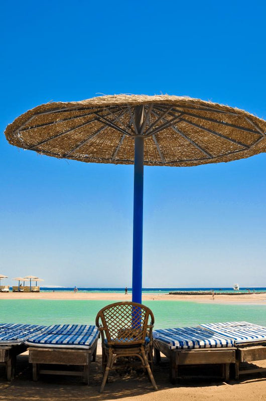 Straw umbrellas on the beach of Egypt Wall Mural