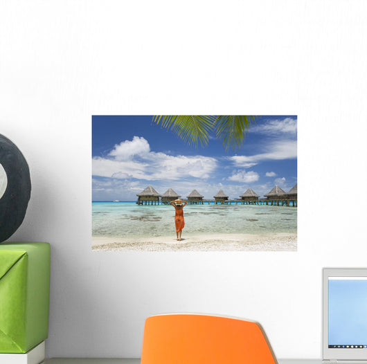 Woman On Beach Near Luxury Resort Wall Mural