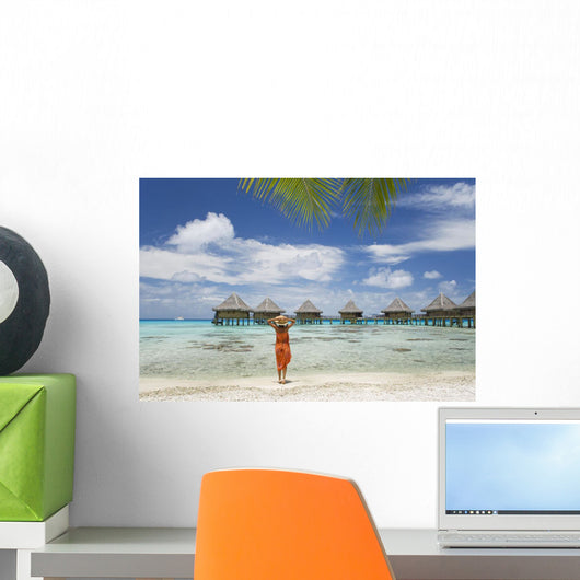 Woman On Beach Near Luxury Resort Wall Mural