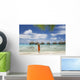 Woman On Beach Near Luxury Resort Wall Mural