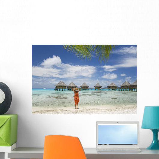Woman On Beach Near Luxury Resort Wall Mural