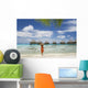 Woman On Beach Near Luxury Resort Wall Mural