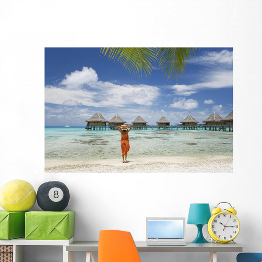 Woman On Beach Near Luxury Resort Wall Mural