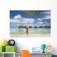 Woman On Beach Near Luxury Resort Wall Mural