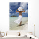 Woman In White Standing At Ocean's Edge Wall Mural