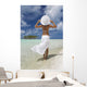 Woman In White Standing At Ocean's Edge Wall Mural