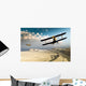 Two vintage WWI double wing biplanes flying over canyon Wall Mural