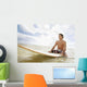 Hawaii, Oahu, Young Man Sitting On His Surfboard At The Shoreline Wall Mural