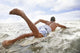 Hawaii, Oahu, Young Man Paddling On His Surfboard In The Water Wall Mural
