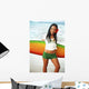 Beautiful Local Girl Smiling And Holding A Colorful Surfboard Wall Mural