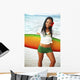 Beautiful Local Girl Smiling And Holding A Colorful Surfboard Wall Mural