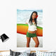 Beautiful Local Girl Smiling And Holding A Colorful Surfboard Wall Mural