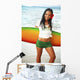 Beautiful Local Girl Smiling And Holding A Colorful Surfboard Wall Mural