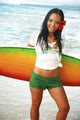 Beautiful Local Girl Smiling And Holding A Colorful Surfboard Wall Mural