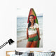 Beautiful Local Girl Smiling And Holding A Colorful Surfboard Wall Mural