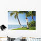 Ready To Swing His Golf Club At A Beach Front Golf Course Wall Mural