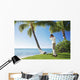Ready To Swing His Golf Club At A Beach Front Golf Course Wall Mural