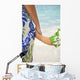 Closeup Of A Mother And Son Holding Hands Facing The Ocean Beach Wall Mural