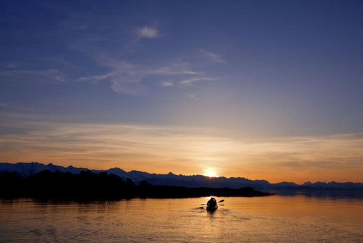 Sunset, Kayaking Through Beautiful Mountain Ranges Wall Mural