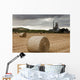 A Cement Production Plant With Hay Bales In A Field In The Foreground Wall Mural