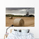 A Cement Production Plant With Hay Bales In A Field In The Foreground Wall Mural