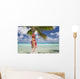 Woman Relaxing On Palm Tree Trunk Overhanging Tropical Ocean Wall Mural