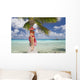 Woman Relaxing On Palm Tree Trunk Overhanging Tropical Ocean Wall Mural