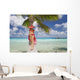 Woman Relaxing On Palm Tree Trunk Overhanging Tropical Ocean Wall Mural