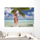 Woman Relaxing On Palm Tree Trunk Overhanging Tropical Ocean Wall Mural