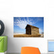 A Wooden Shed Stands Alone In A Snow Covered Field Wall Mural